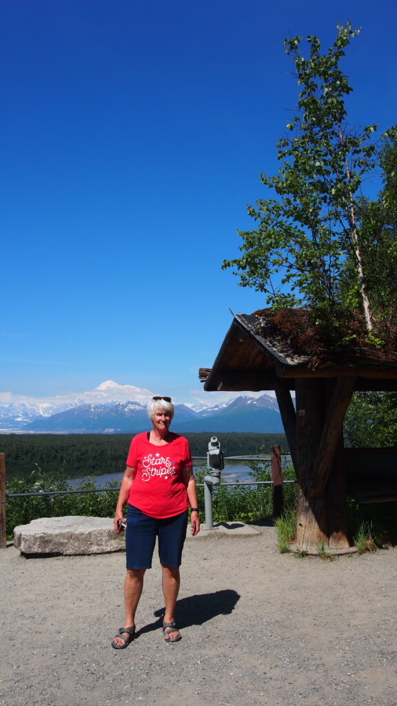 Denali shelter with Theresa and trees